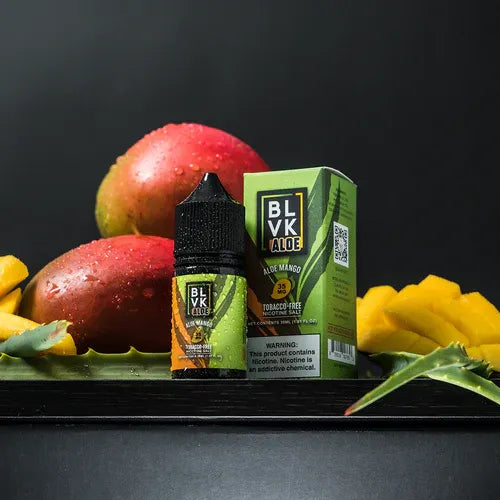 BLVK Aloe mango vape juice bottle and packaging with mangoes on a dark background